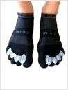 Tenenspreider kan ook over sokken gebruikt worden